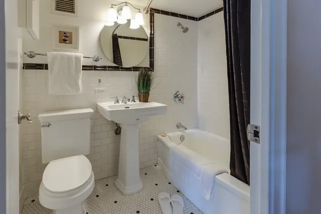 Elegant bathroom renovation with freestanding tub by Kile Construction
